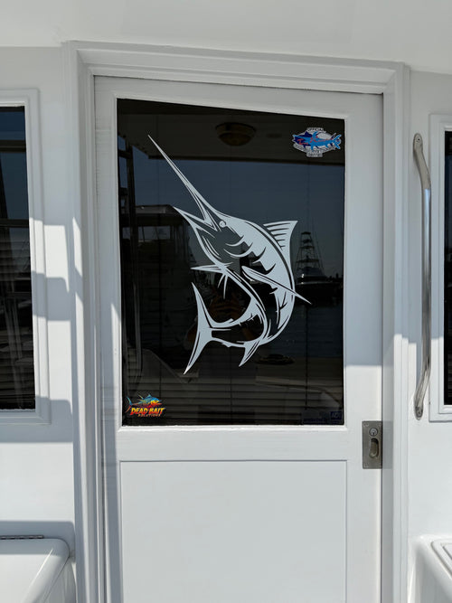 Glass door with a fish design and Meguiar's logo on a vehicle